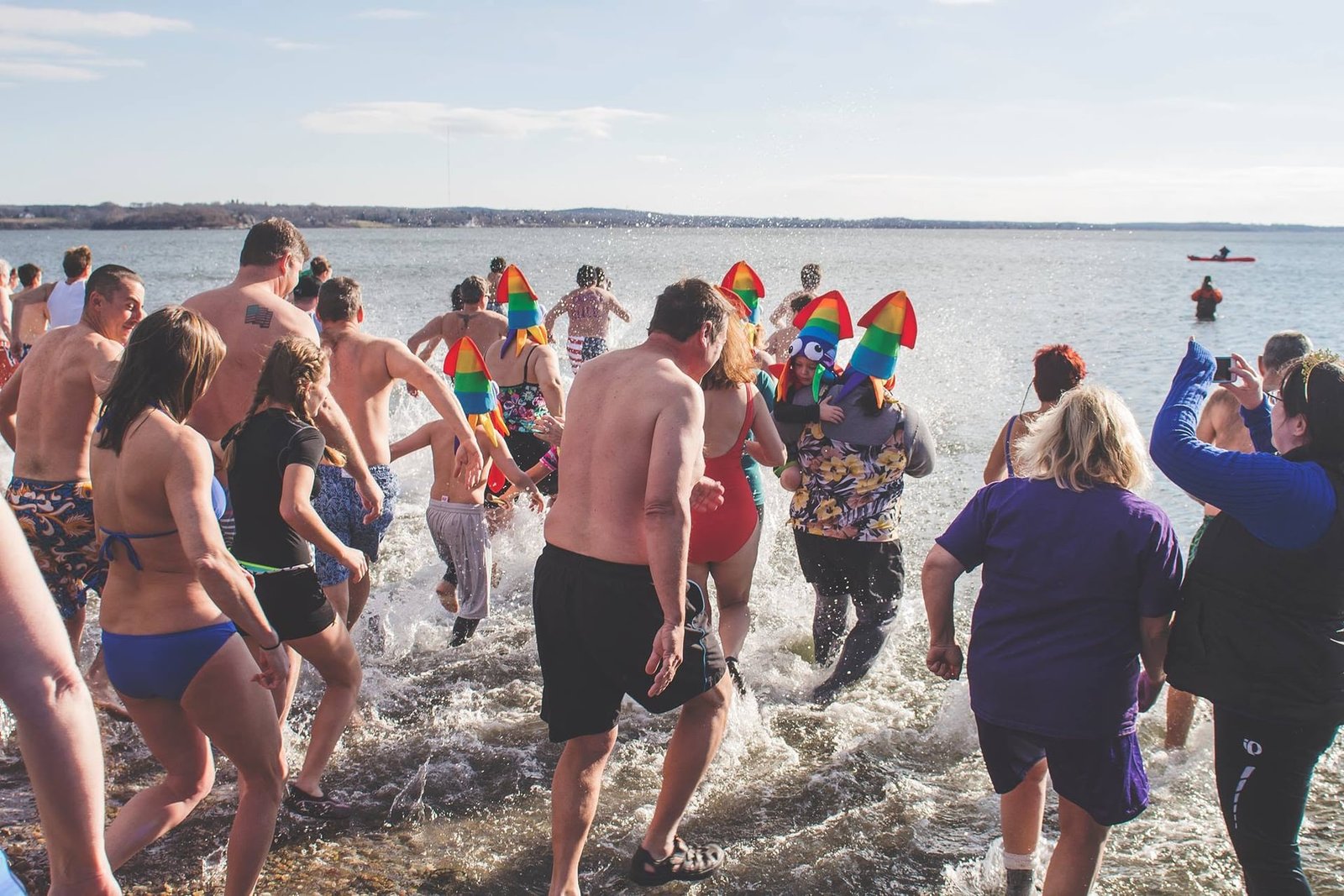 Crowd splashing into the bay on New Year's Day at Island Park Beach