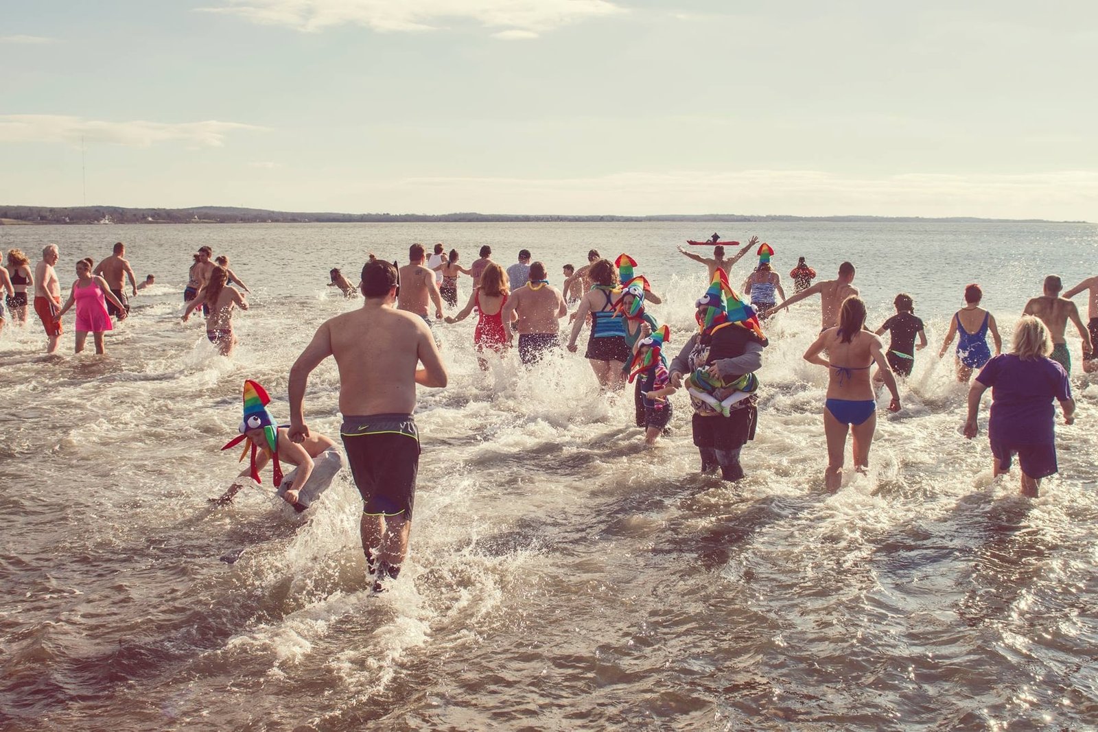 Neighbors running into the water for the Island Park Polar Dive
